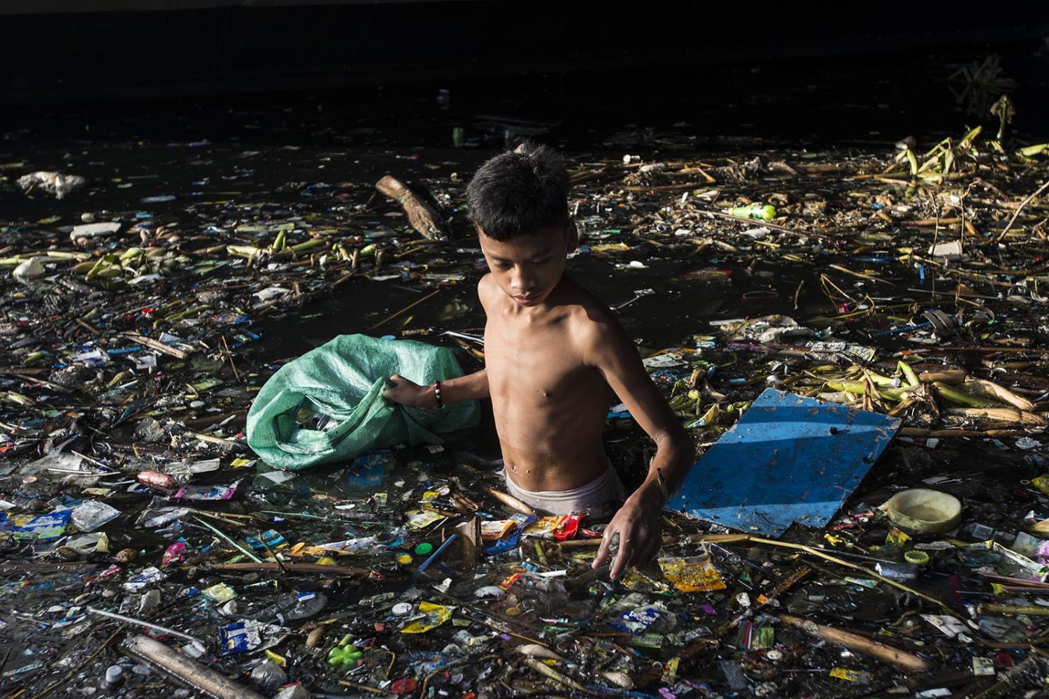 Jay-Jay living on collecting single use plastic, Tondo, Manila. He earns about 0.26 euro per every Kg he collects. Since Jay- Jay mother died a while back he is currently living with his Lola(grandmother).